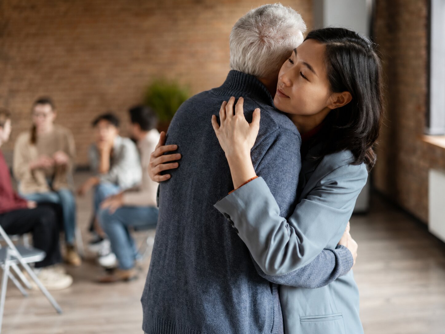 Two people in quiet connection — caring for the caregiver, Issue Three